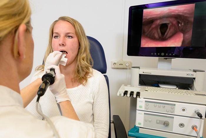 Laryngoscopy examination in an ENT clinic with patient seated